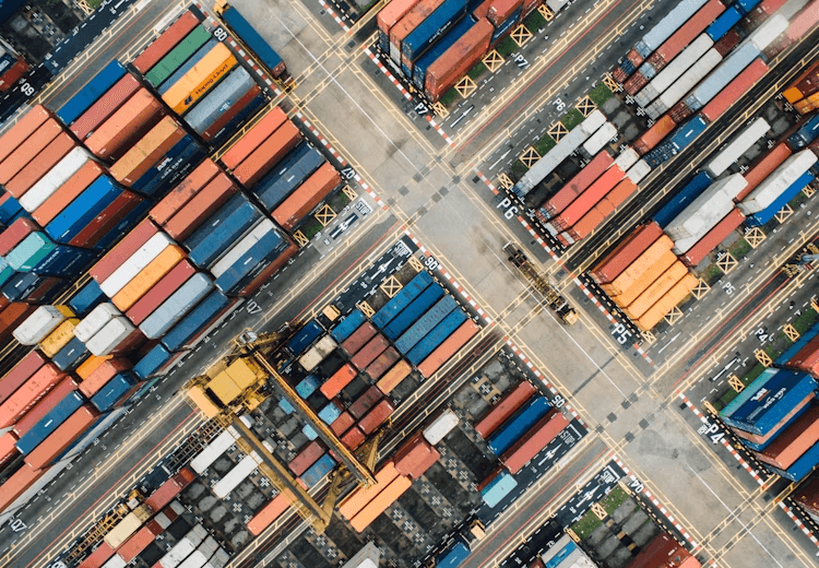 Aerial view of stacked shipping containers at an export terminal