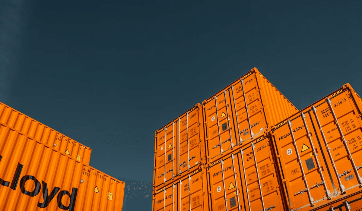 Stacked shipping containers seen from below